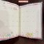 สมุด 2026 Schedule Book เล่มกลาง A6 ลาย Sumikko Gurashi Amusement Park ขนาด 10.8 x 15.5 x 0.5 ซม. (64 หน้า) มีให้จดตั้งแต่เดือน 10/2025 - 3/2027 เป็นปฎิทินแบบ monthly ช่องกลาง มีหน้าว่างให้เขียน