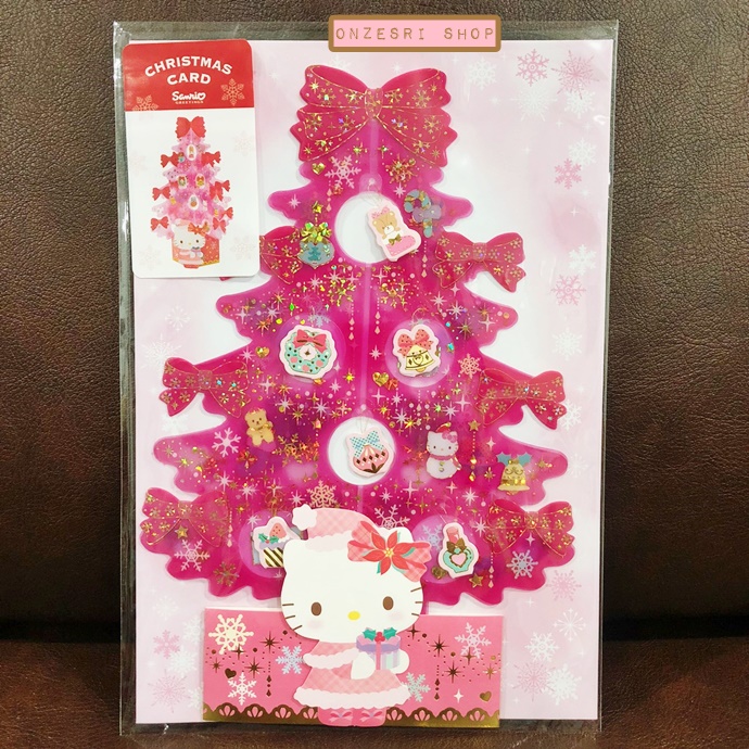 Sanrio Christmas Pop Up Card From Japan การ์ดอวยพรลาย Hello Kitty สีชมพู ทำจากพลาสติกแข็งใส กางออกมาเป็นต้นคริสต์มาสได้น่ารัก มีการ์ดกระดาษที่ไว้เขียนแนบมาให้ ขนาด 14.5 x 0.5 x 21.5 ซม.