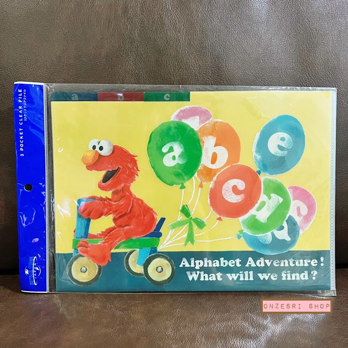 แฟ้ม A4 Sesame Street สีเหลือง (ลาย Elmo ขี่จักรยาน) แยกใส่เอกสารได้ 3 ช่อง มีขายเฉพาะที่ Universal Studios Japan เท่านั้น