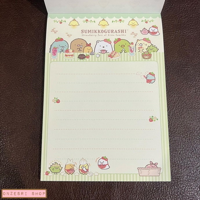 สมุดฉีก Sumikko Gurashi Strawberry Fair แบบสีชมพู ขนาด 14.8 x 10.5 ซม. มี 4 ลาย รวม 100 แผ่น แผ่นแรกเป็นสติกเกอร์