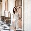 Nella Ruffle Shoulder Dress - สีครีม